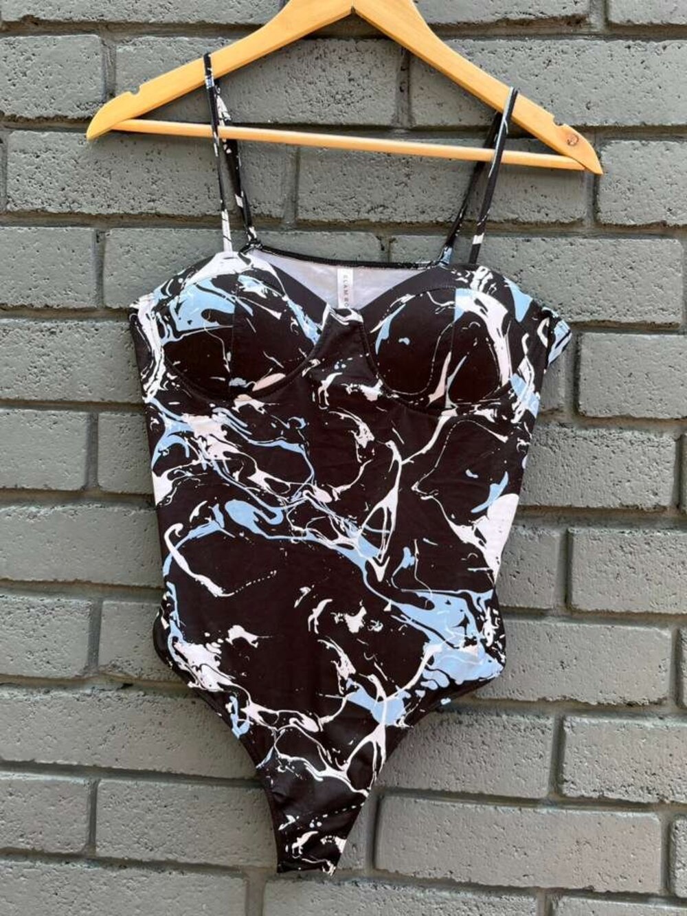 Glam rocks one piece Paint Drop Print bodysuit with padded cups Adjustable Strap